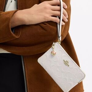 Coach White Embossed Signature Wristlet with Gold Accents